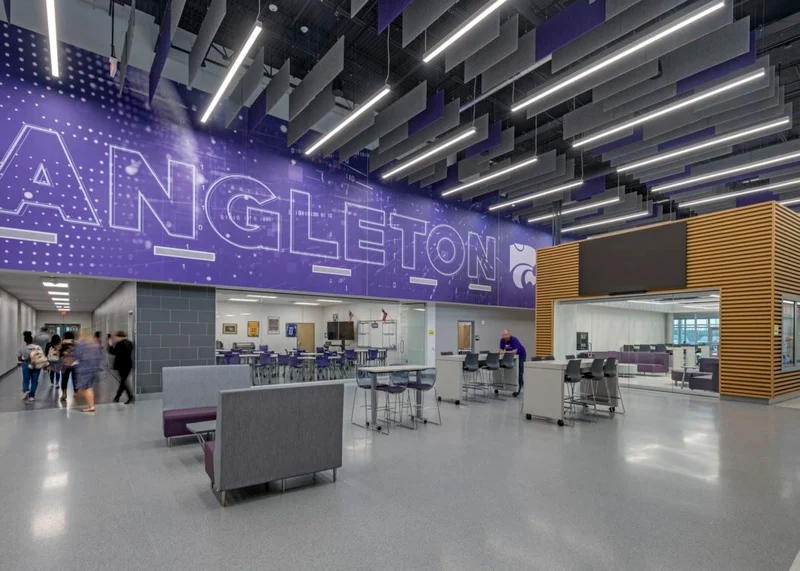 Student commons inside the Angleton Technology and Education Center, with Angleton signage overhead