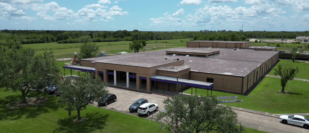 Aerial view of Frontier Elementary School and its surrounding fields in Angleton ISD